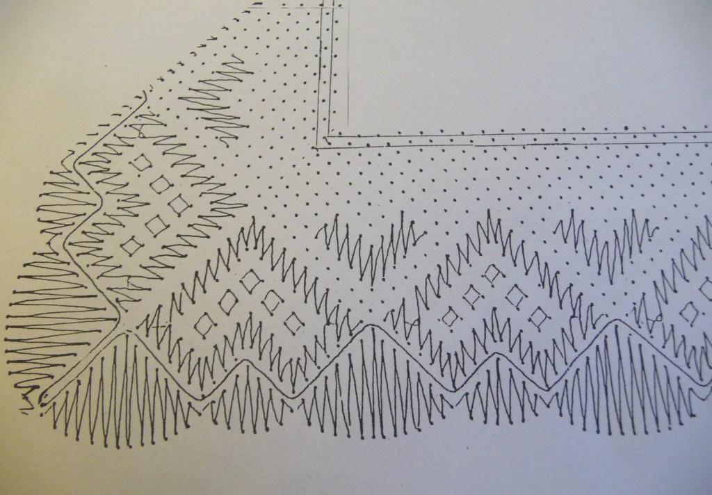 A lace pattern pricking of black ink dots on white paper