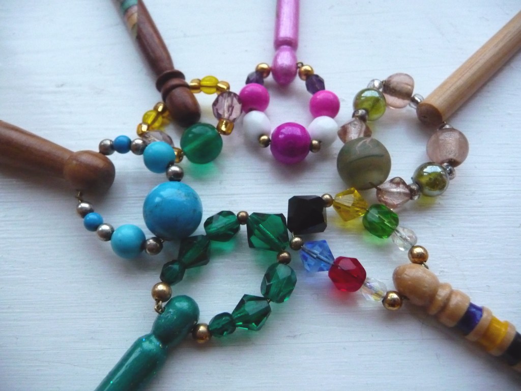 Six brightly coloured beaded spangles arranged in a circle